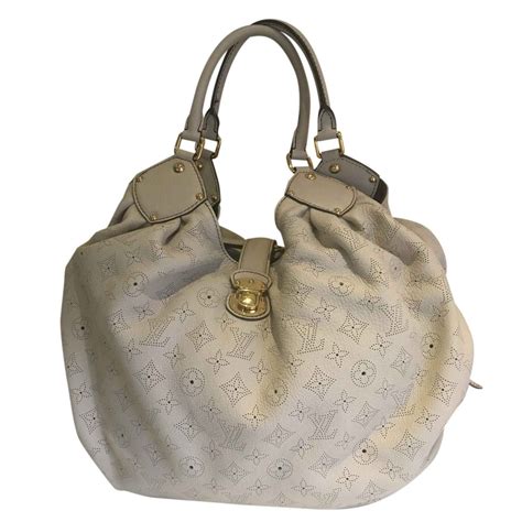 black and cream louis vuitton bag|louis vuitton mahina bag price.